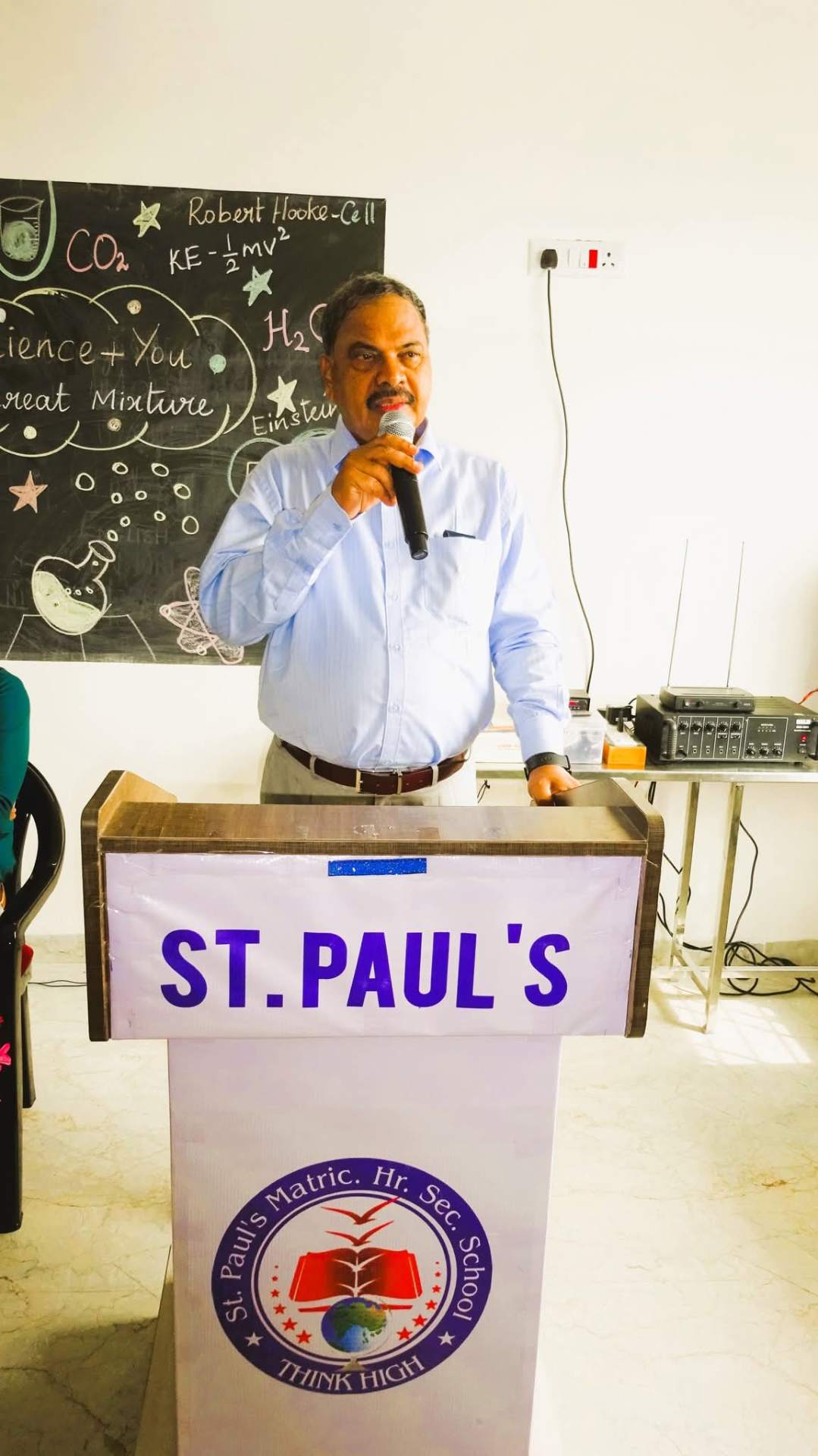 Dr. P. Sethu, founder of St. Paul's Matric. Hr. Sec. School, addressing students from the school podium